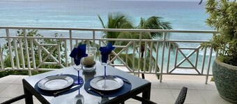 SEA SIDE LOCATION, STEPS TO A SANDY BEACH AND SWAYING PALMS!