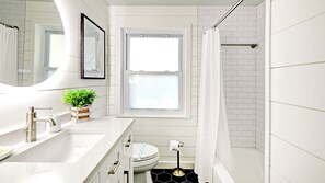 Combined shower/tub, hair dryer, towels, soap