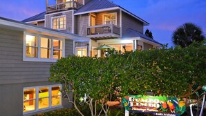 A two-story house with multiple windows and a balcony. -  ⭐️ Pool & Gulf Views, 2BR + Den,  Prime Siesta Key Location (Sarasota)