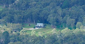 An aerial view of a house surrounded by dense forest. - Megalong Valley, home of the mill (Megalong Valley)