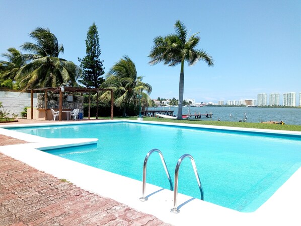 Outdoor pool, open 7 AM to 11:30 PM, pool umbrellas, pool loungers