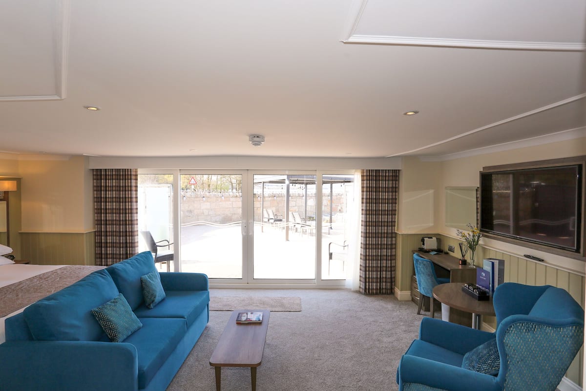 executive suite, lake view | individually furnished, desk, iron/ironing board, free wifi