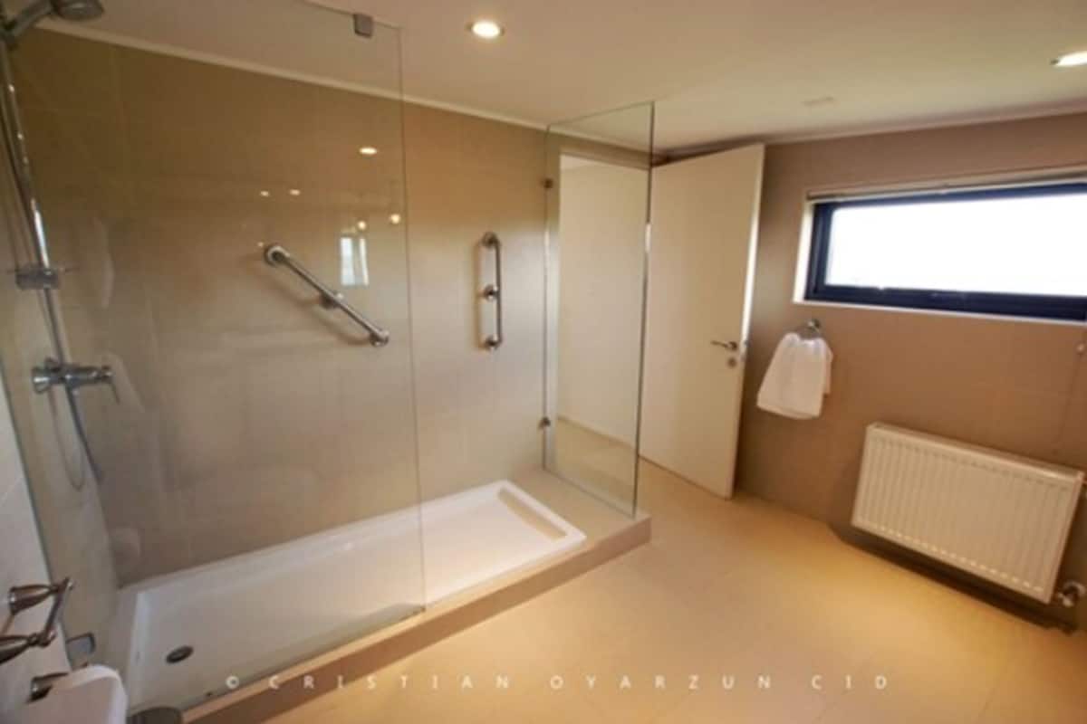 suite | bathroom | shower, slippers, towels