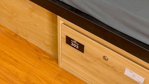 A wooden drawer with a label indicating room number 303. - 10 Dollar Homestay Danang - Hostel (Da Nang)