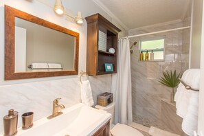 Shower, hair dryer, towels, soap
