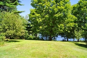 Surrounded by lush trees and a serene landscape, this peaceful setting invites relaxation.