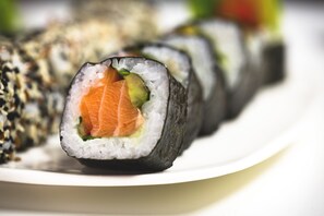 A plate of sushi rolls with a variety of fillings. - Portofino (Wloclawek)