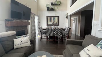 Smart TV, fireplace, books, printers