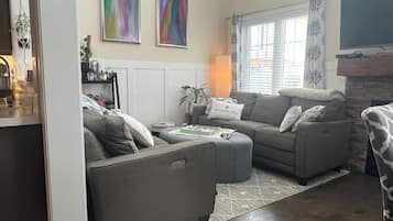 Smart TV, fireplace, books, printers