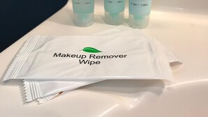 Three Hydra Spa products: shampoo, conditioner, and body cream, along with a makeup remover wipe.