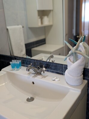 Bathtub, hair dryer, towels
