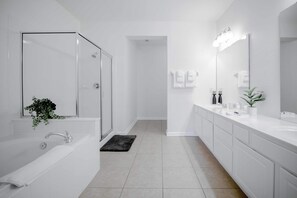Combined shower/tub, hair dryer, towels, soap
