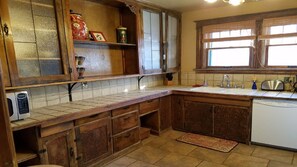Coffee/tea maker, fridge, microwave, oven - Historic Downtown Home (Colorado Springs)