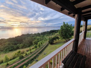A balcony with a view of a coastal landscape, including a path and greenery. - Over the Horizon near Savusavu Market (Savusavu)