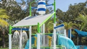 A water play area with slides and a water fountain. - Aco240198 - Golden Palms Resort - 7 Bed 6 Baths Villa (Kissimmee)