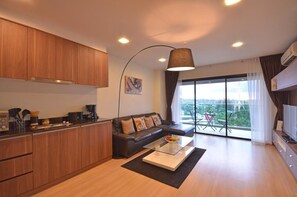 Junior Studio Suite | Living area | 32-inch LCD TV with cable channels, TV - Golden Manora Hotel Bangtao Beach (Choeng Thale)