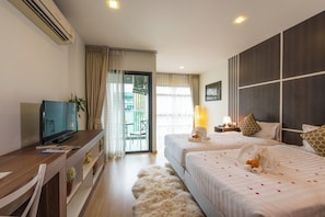 Deluxe Studio, 2 Twin Beds | Free minibar items, in-room safe, desk, blackout drapes - Golden Manora Hotel Bangtao Beach (Choeng Thale)