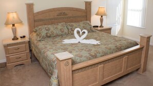 A neatly made bed with a floral bedspread and two bedside lamps. - Ip60154 - Highgate at Legacy Park - 5 Bed 3.5 Baths Villa (Davenport)