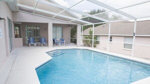 A swimming pool with a covered area, lounge chairs, and a table. - Ip60569 - Westridge - 5 Bed 3 Baths Villa (Davenport)