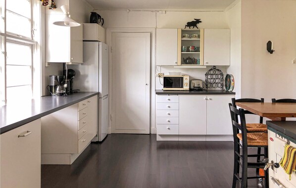 Fridge, stovetop, dishwasher, coffee/tea maker