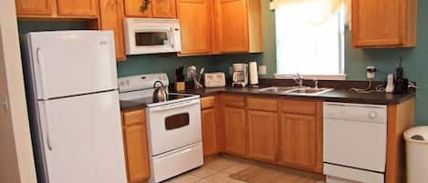 Family Villa, Garden Area | Shared kitchen | Fridge, microwave, oven