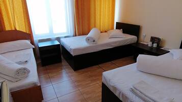 Economy Triple Room | Iron/ironing board, cots/infant beds, free WiFi, bed sheets