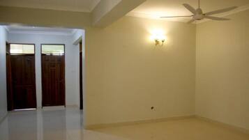 Apartment, 3 Bedrooms | Living room | Flat-screen TV