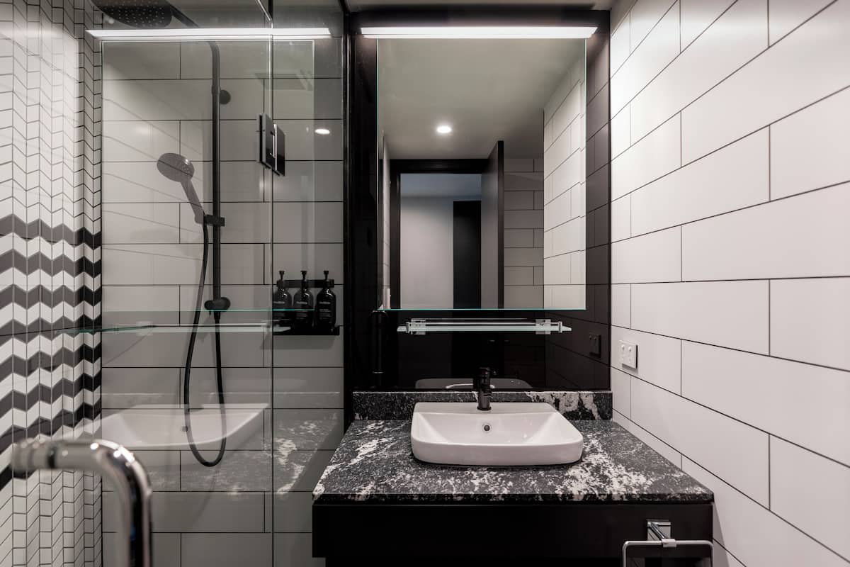 standard queen queen | bathroom | shower, rainfall showerhead, eco-friendly toiletries, hair dryer