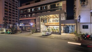 A multi-story hotel with a prominent sign for 'Pravasa Hotel'. - Pravasa Hotel by Sapphire, Vadodara (Vadodara)