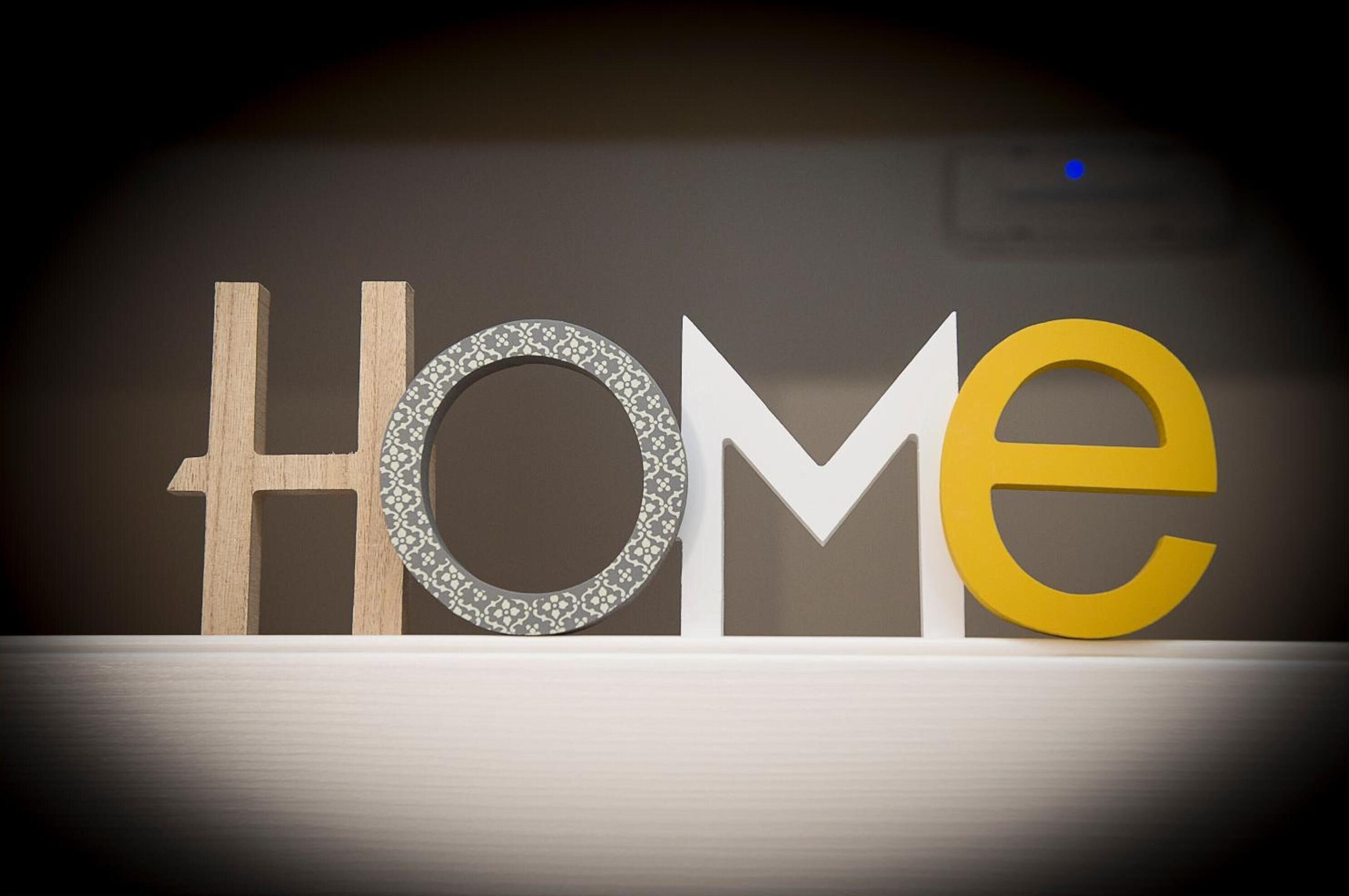 A display of the word "HOME" with different font styles and colors.