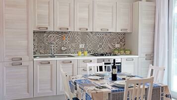 Family Villa, 2 Bedrooms | Private kitchen | Full-sized fridge, oven, stovetop, cookware/dishes/utensils