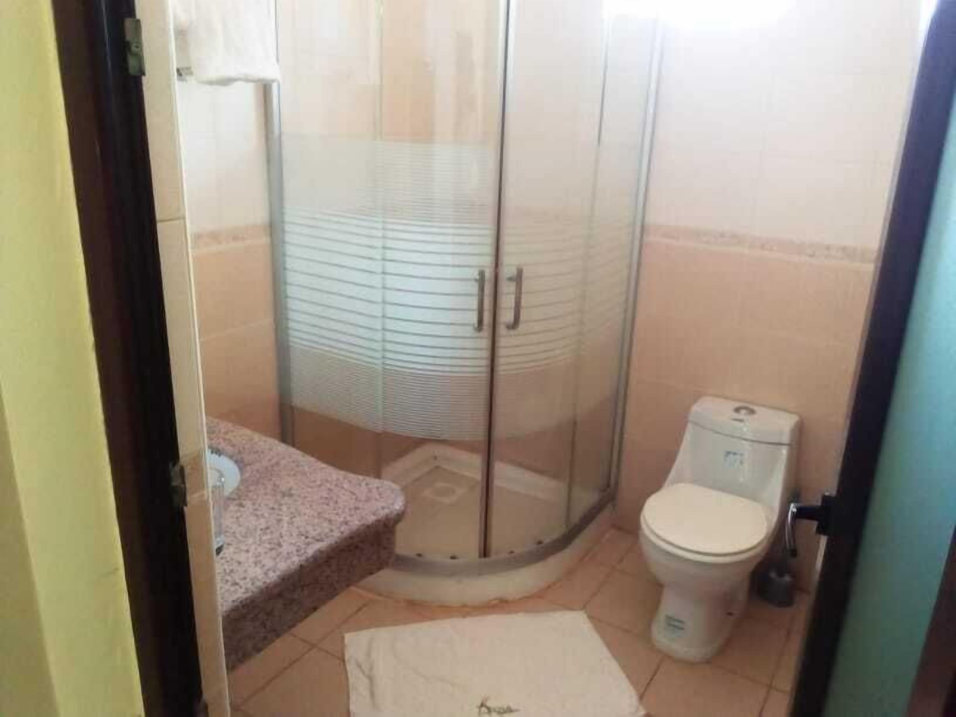 executive double room, 1 king bed, non smoking | bathroom | shower, rainfall showerhead, free toiletries, slippers