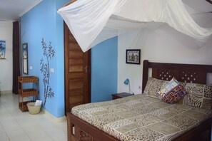 Deluxe Triple Room | Premium bedding, in-room safe, individually decorated - Highland Bungalows (Nungwi)