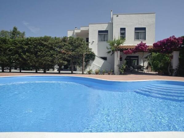 Seasonal outdoor pool, pool loungers
