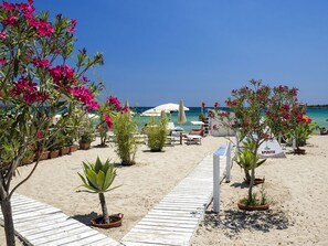 On the beach, white sand, beach towels