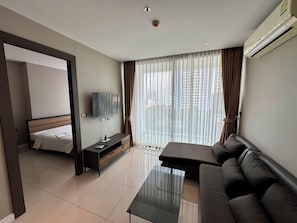 Apartment, 1 Schlafzimmer, eingeschränkter Meerblick | Wohnbereich