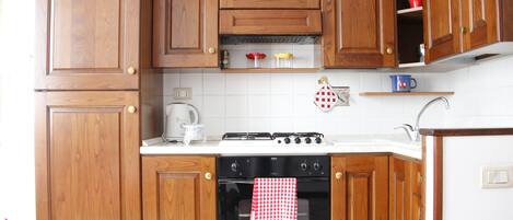 Apartment, 1 Bedroom | Private kitchenette | Full-sized fridge, microwave, oven, stovetop