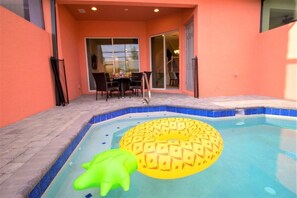 A swimming pool with a pineapple float and a green shark float. - Aco243801 - Festival Resort - 5 Bed 4.5 Baths Townhome (Davenport)
