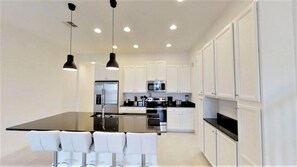 Family Townhome, Garden Area | Shared kitchen