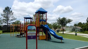 A playground with a blue slide and climbing structures. - Bjw538 - Sandy Ridge - 4 Bed 3 Baths Villa (Davenport)