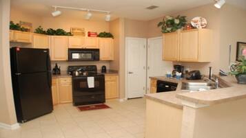 Family Condo, Garden Area | Shared kitchen | Fridge, microwave, oven