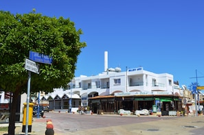 A town hall, a post office, and a building with a 'Footloose Bar' sign.