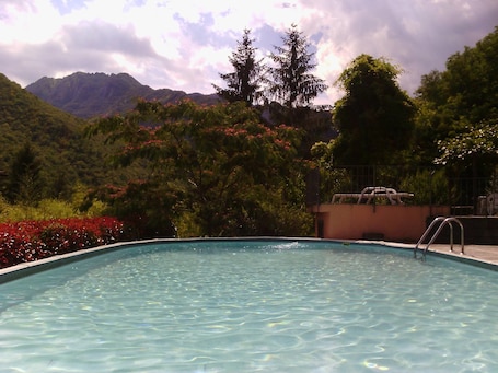 Seasonal outdoor pool, pool umbrellas, pool loungers