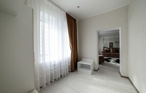 Junior Suite | Living area | 20-inch LCD TV with cable channels, TV - Premier (Nizhny Novgorod)