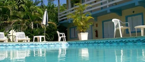 Outdoor pool, pool umbrellas, sun loungers