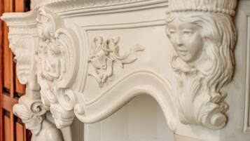 A detailed white architectural feature with ornate carvings and a curved design.