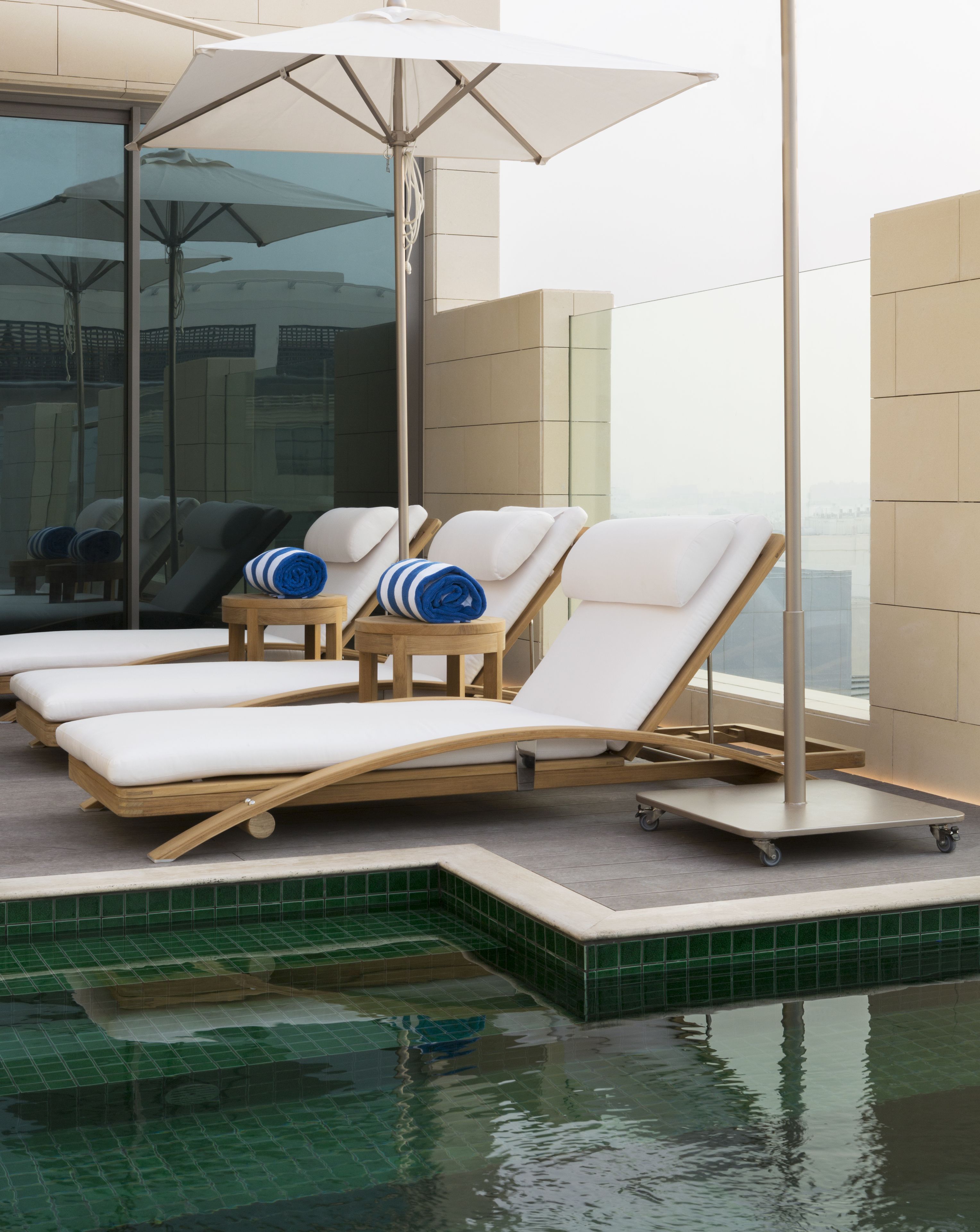 outdoor pool, pool umbrellas, pool loungers