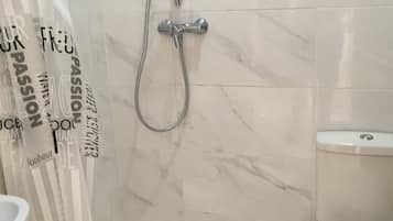 Shower, free toiletries, hair dryer, towels