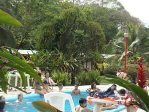 Outdoor pool, open 8 AM to 10 PM, pool umbrellas, sun loungers