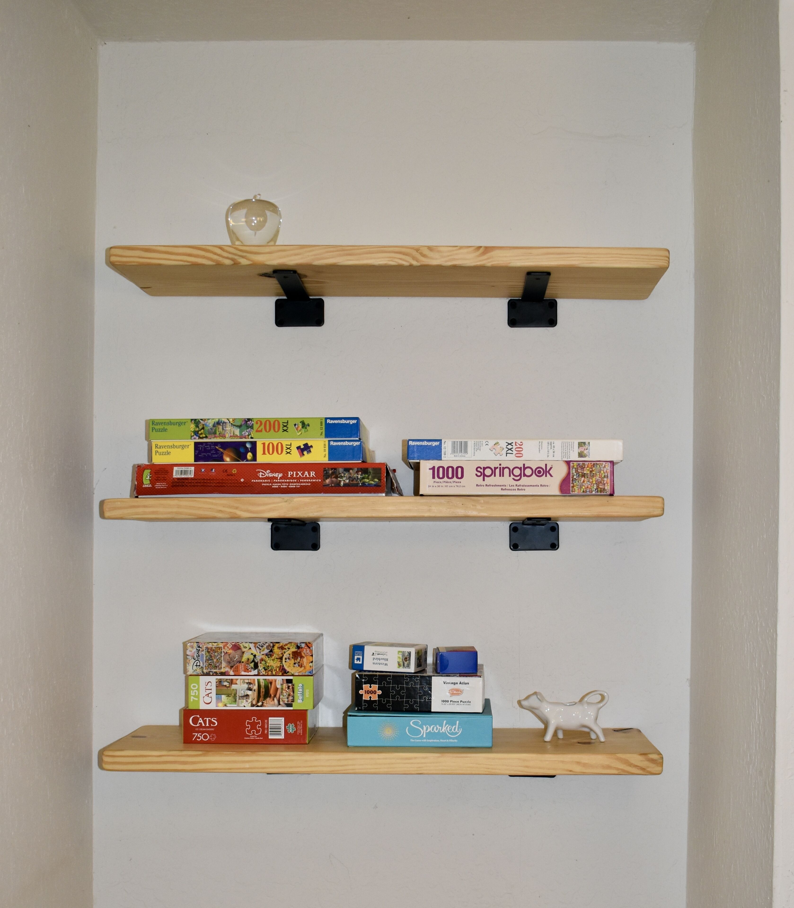 Shelving off the dining area with puzzles and games